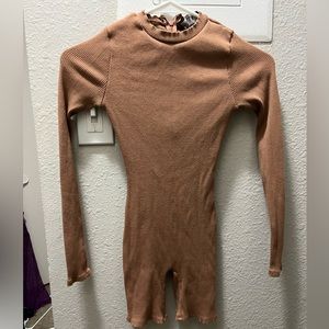 Sorella boutique romper in size Small. It is a light brown/nude color.
